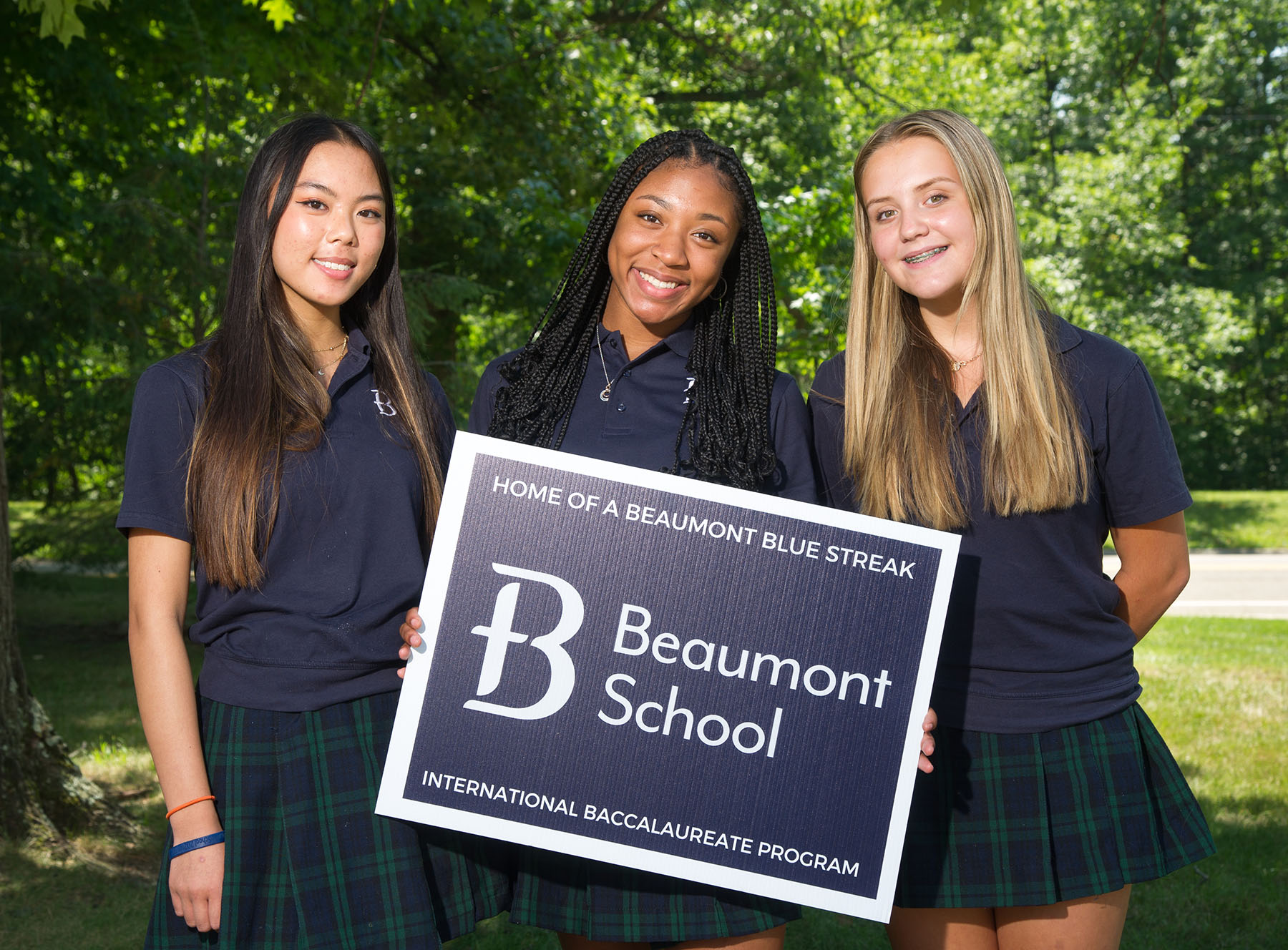 Beaumont Girls with sign copy Breakthrough Public Schools BPS